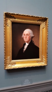 This is that famous painting of George Washington painted by Gilbert Stuart. It dates to c. 1821.