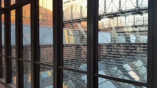 This is one of the glass walkways in the museum. The names on the glass are all of the communities that were impacted by the Holocaust. There is another glass walkway with the names of all of the victims.